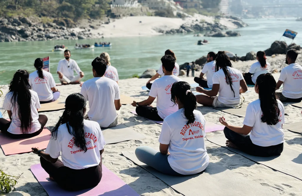 Rudra Yogpeeth students meditating on the banks of the Ganga in Rishikesh