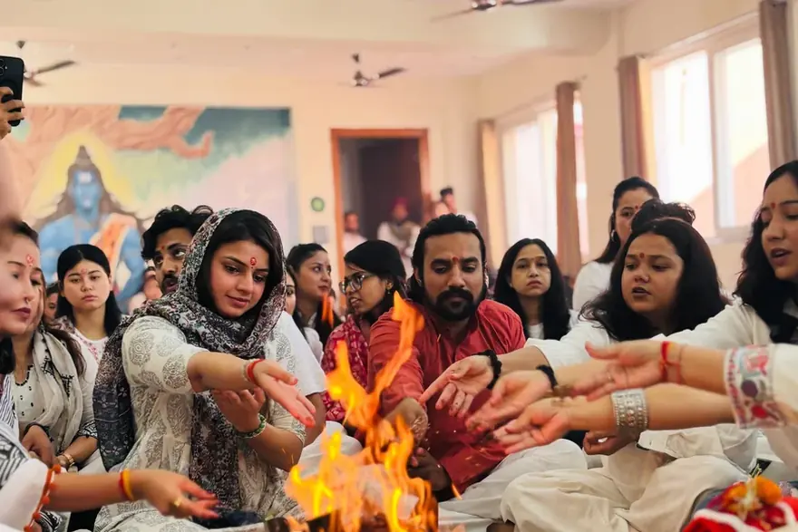 Students and teachers gathered around the fire at the morning havan, Rudra Yogpeeth