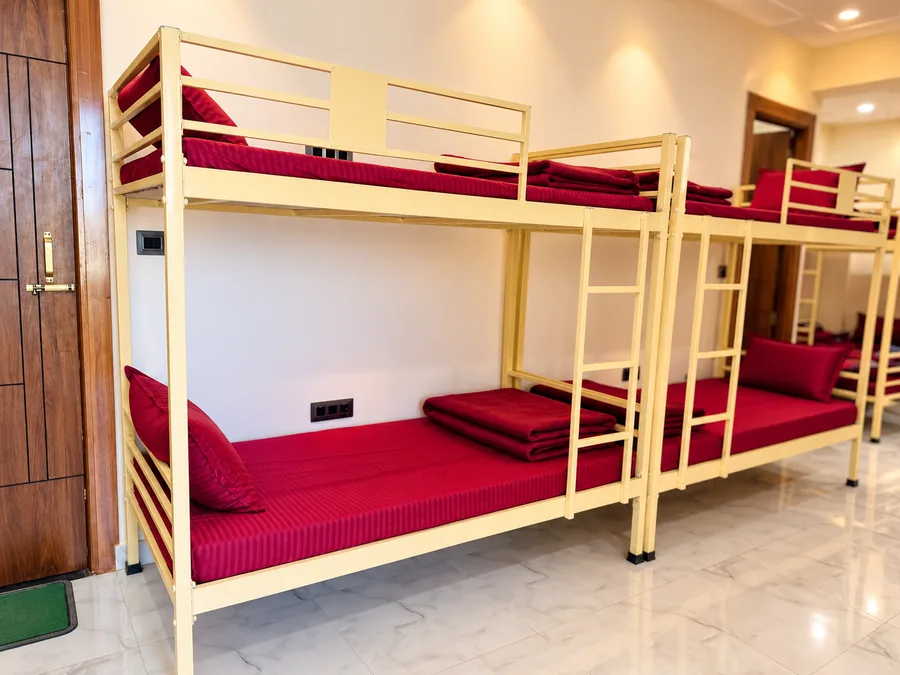 Six-sharing dormitory layout at the Rishikesh yoga school
